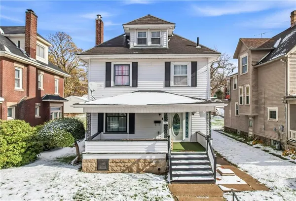 a front view of a house with a porch