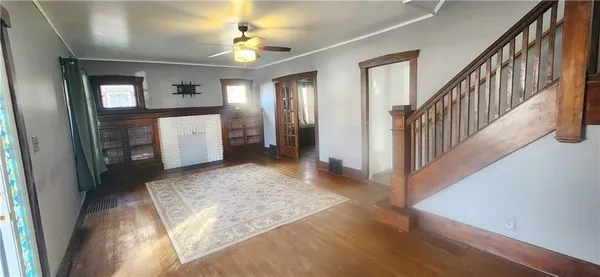 a view of entryway with window and hallway