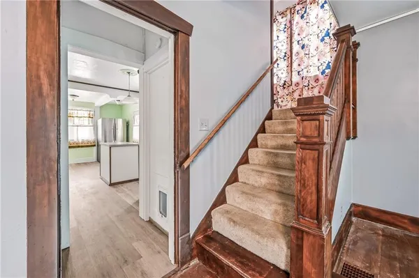 a view of entryway with wooden floor
