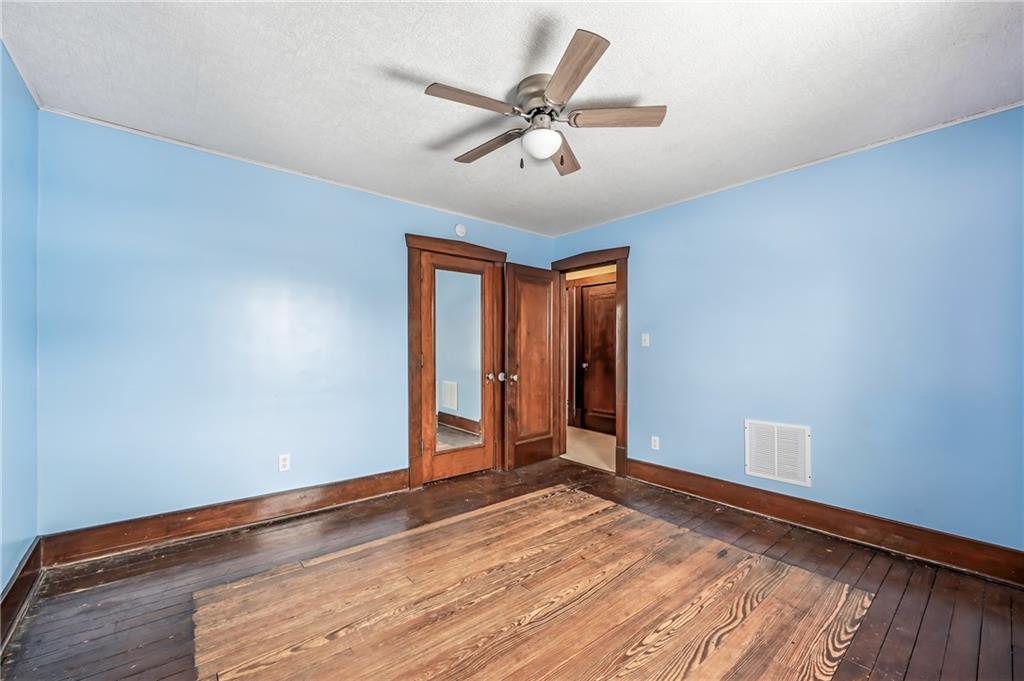 300 Ormond Avenue Sharon, PA 16146 - Photo 38 of 45 a view of an empty room with wooden floor and a ceiling fan