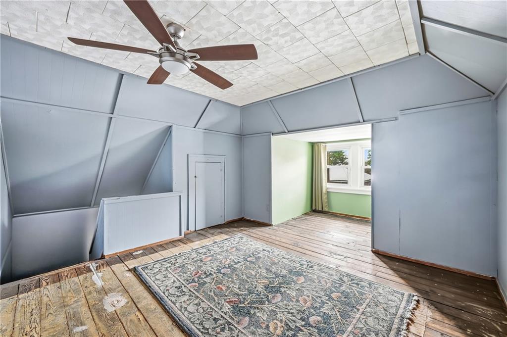 300 Ormond Avenue Sharon, PA 16146 - Photo 40 of 45 a view of a big room with a fireplace and wooden floor