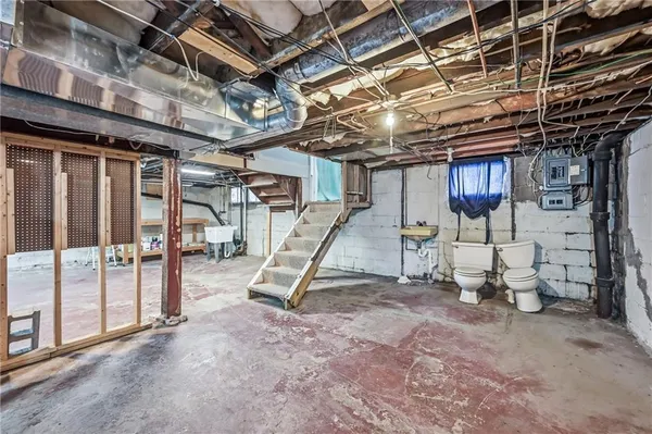 a view of a room with wooden shelves