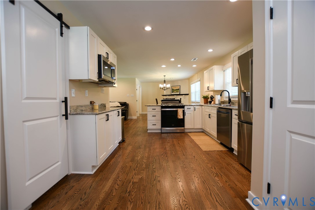 1448 Canterbury Road St. Stephens Church, VA 23148 - Photo 15 of 57 Open-concept kitchen featuring hardwood floor, whi