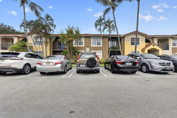 a view of a car parked in front of a house
