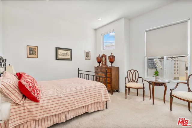 a bedroom with a bed and a lamp