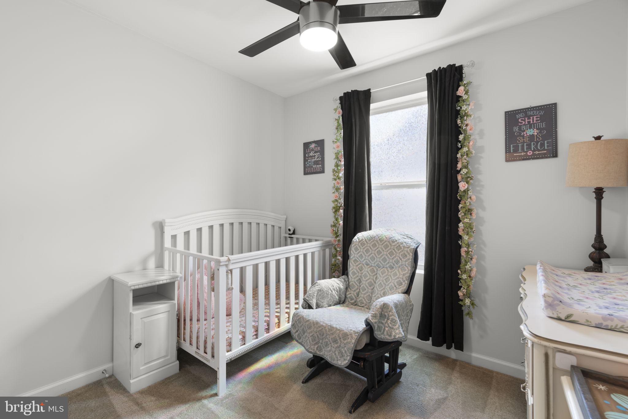 465 Carvel Beach Road Carvel Beach, MD 21226 - Photo 12 of 30 a bedroom with furniture and a window