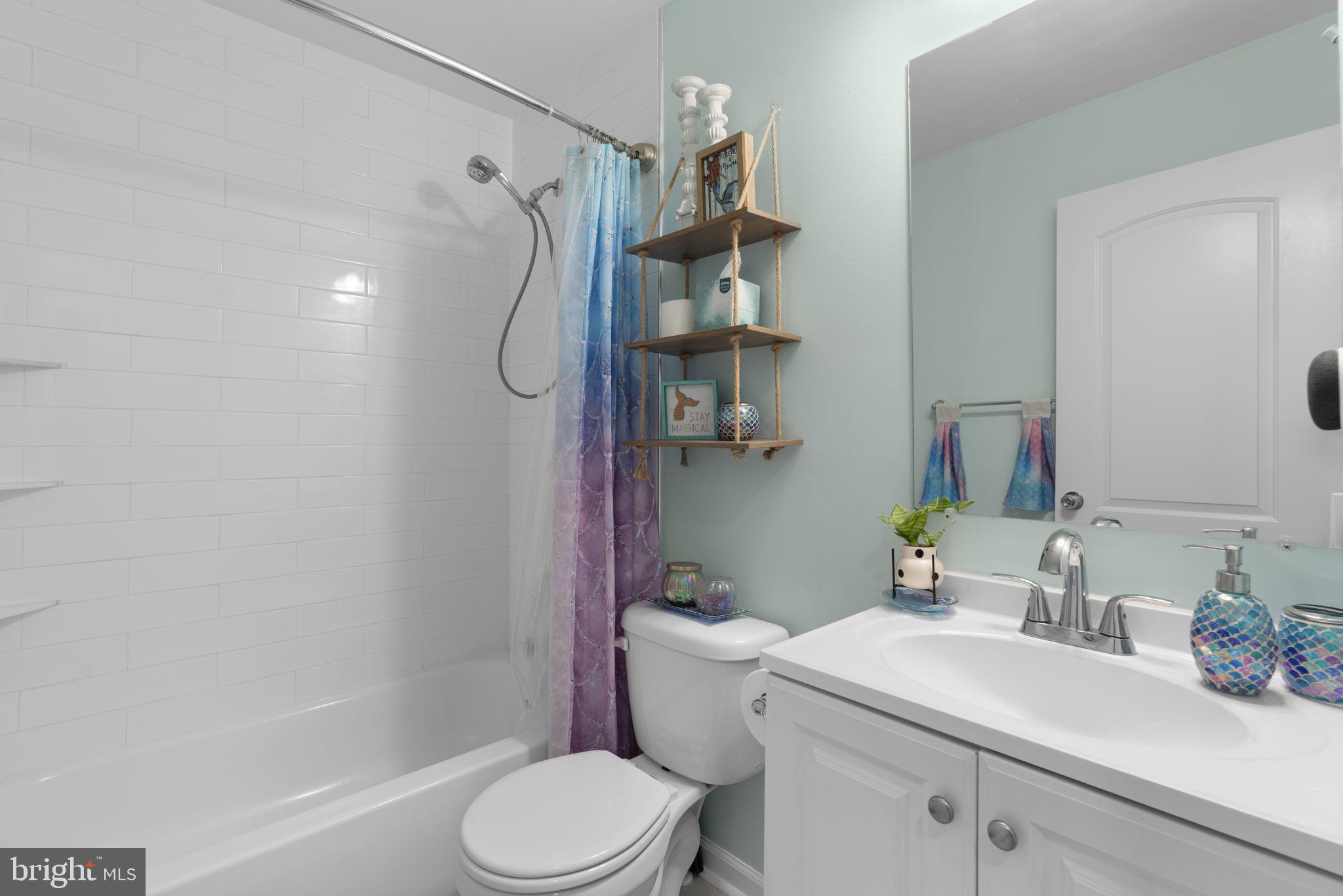 465 Carvel Beach Road Carvel Beach, MD 21226 - Photo 14 of 30 a bathroom with a sink toilet and shower