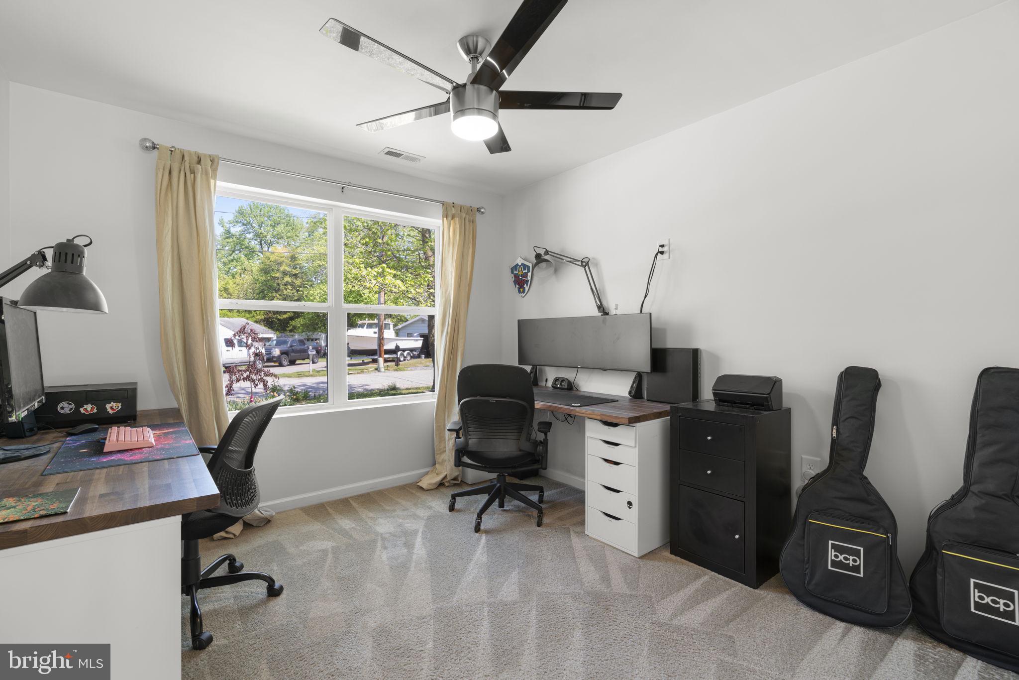 465 Carvel Beach Road Carvel Beach, MD 21226 - Photo 15 of 30 a view of a workspace with furniture and a window