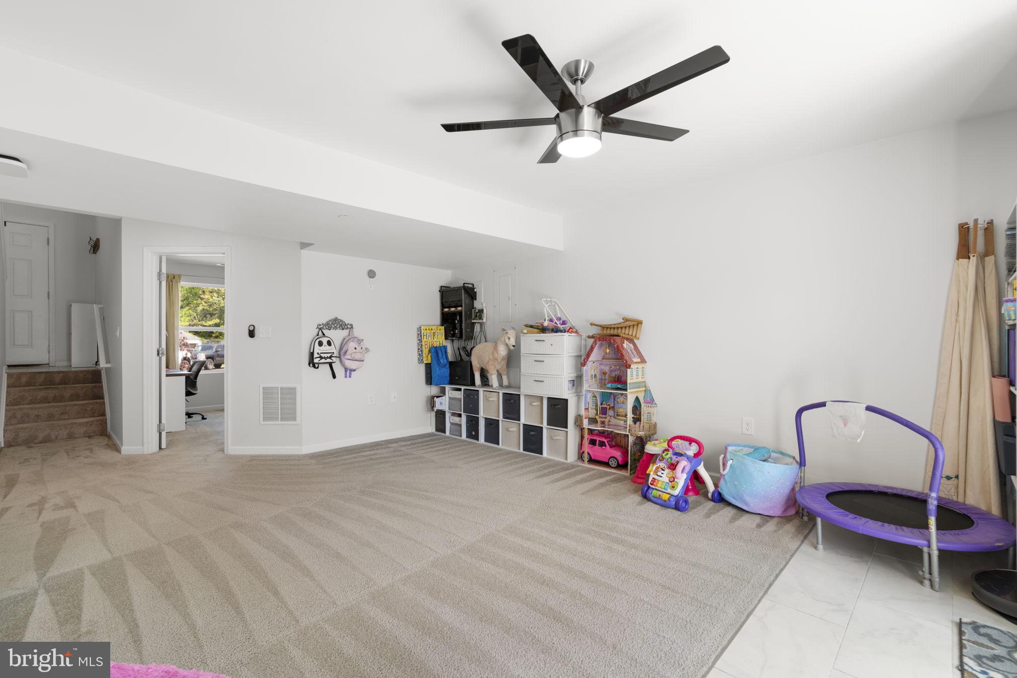 465 Carvel Beach Road Carvel Beach, MD 21226 - Photo 20 of 30 a view of a livingroom with furniture and a ceiling fan