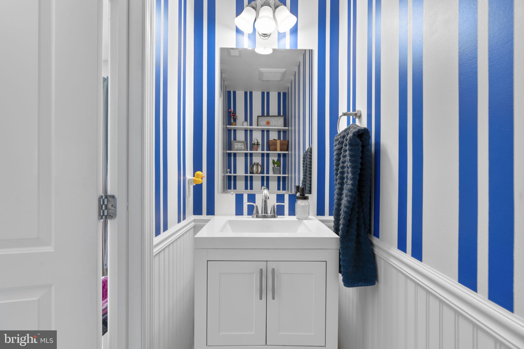 465 Carvel Beach Road Carvel Beach, MD 21226 - Photo 21 of 30 a utility room with closet and chandelier