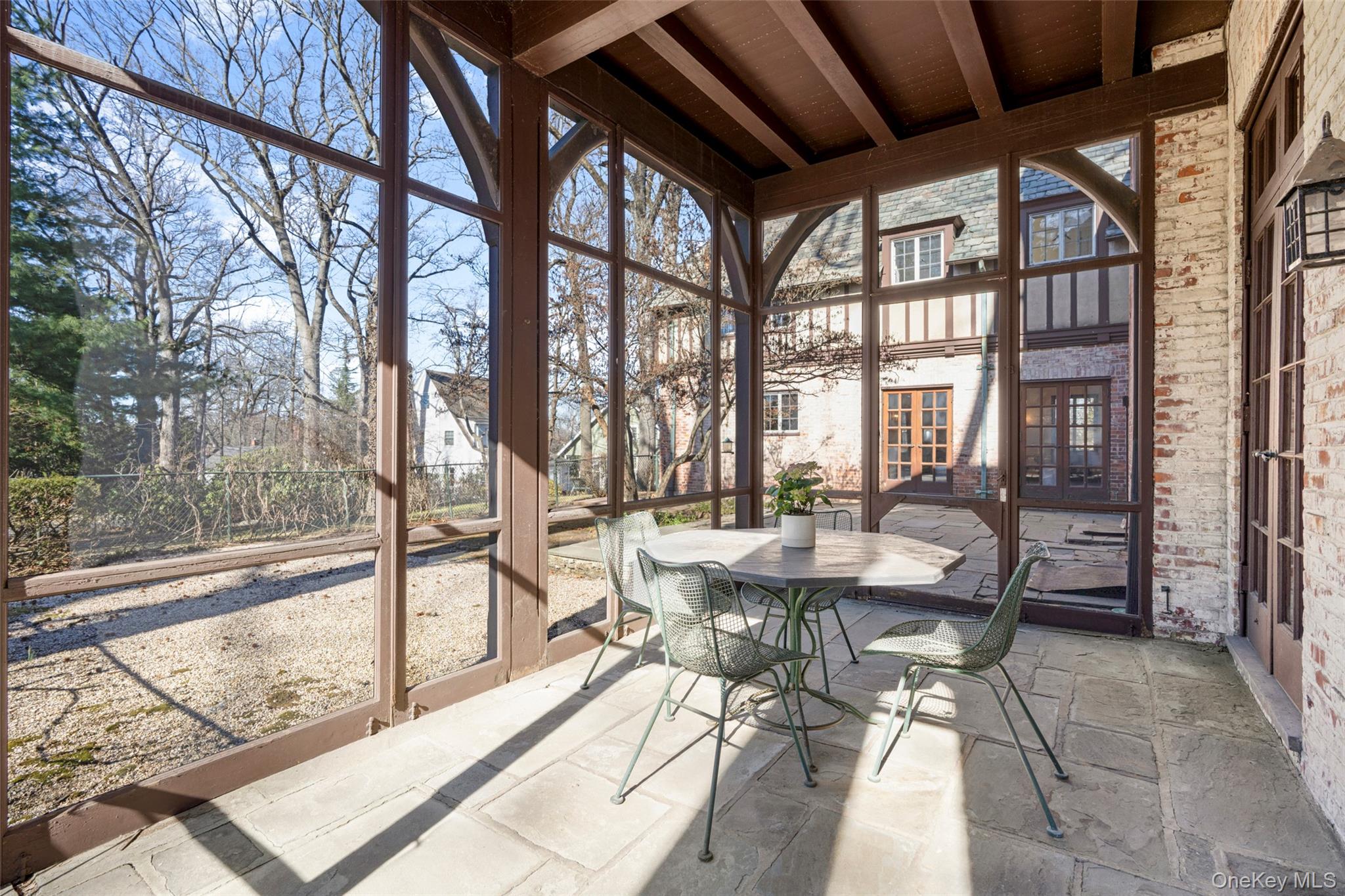 60 Wildwood Road New Rochelle, NY 10804 - Photo 11 of 49 a dining room with furniture and large windows