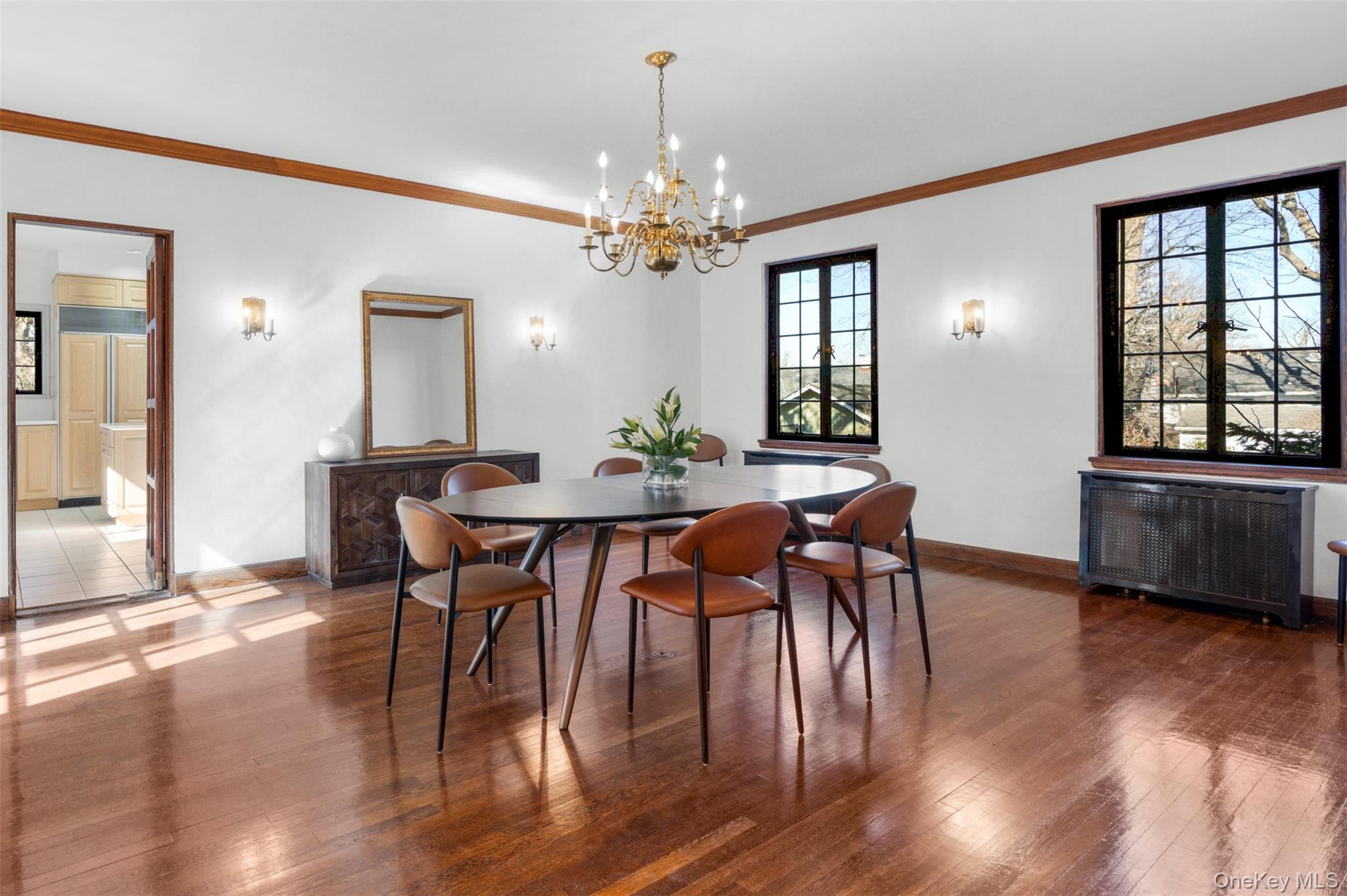 60 Wildwood Road New Rochelle, NY 10804 - Photo 16 of 49 a view of a dining room with furniture window and wooden floor
