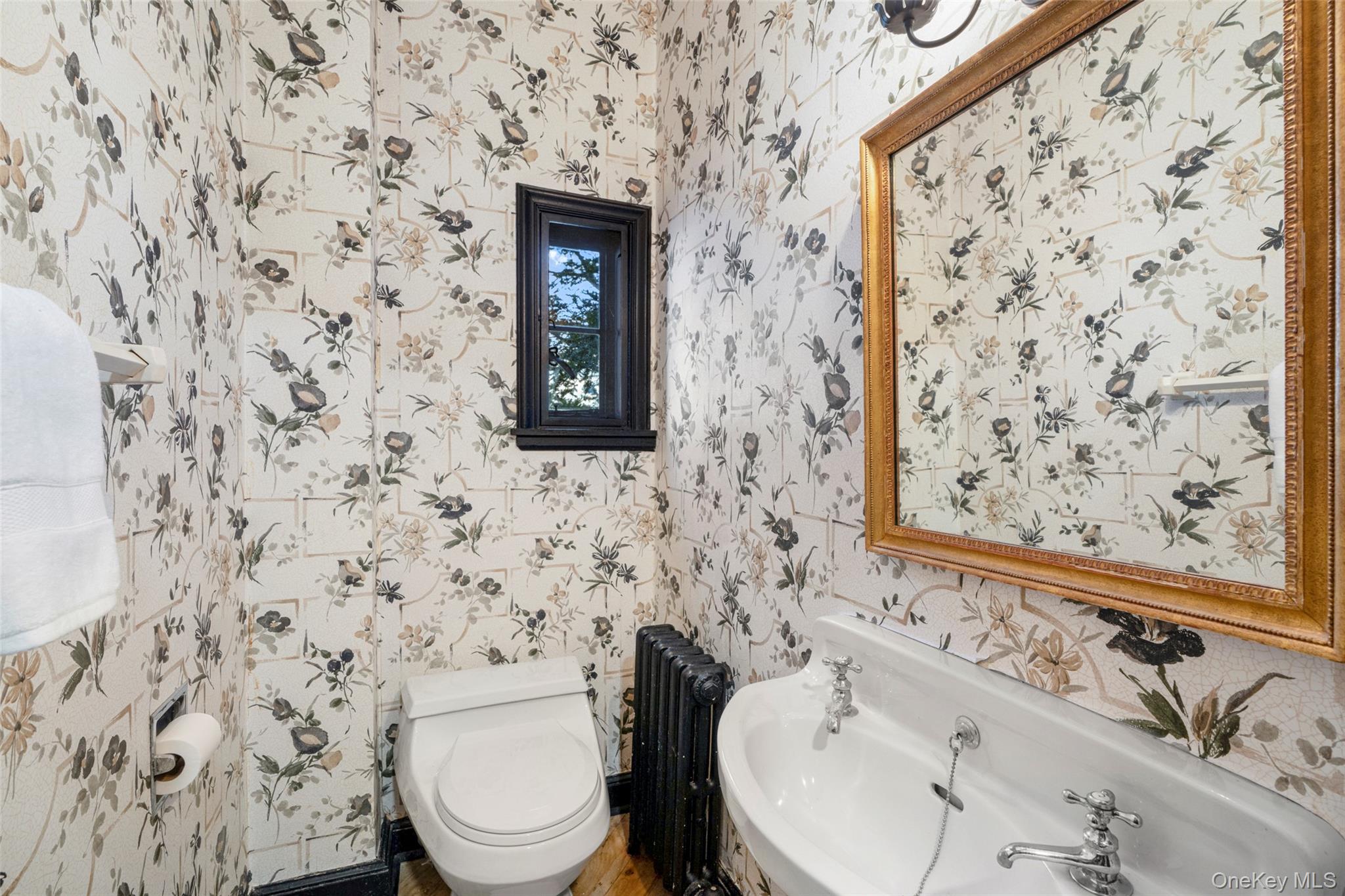 60 Wildwood Road New Rochelle, NY 10804 - Photo 19 of 49 a bathroom with a toilet and a sink