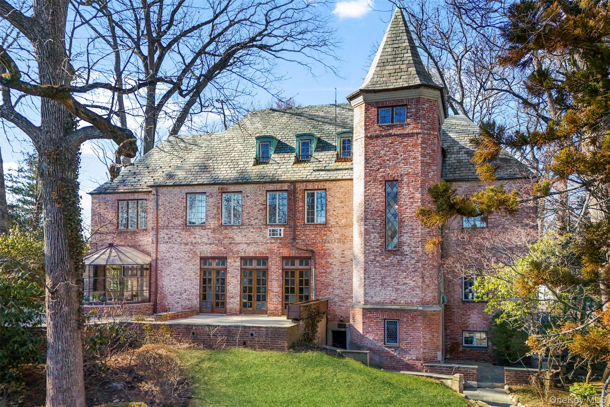 60 Wildwood Road New Rochelle, NY 10804 - Photo 2 of 49 front view of a house with a yard