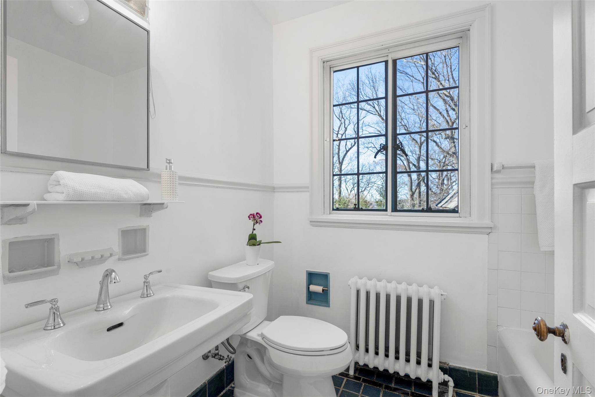 60 Wildwood Road New Rochelle, NY 10804 - Photo 33 of 49 a bathroom with a sink and a toilet