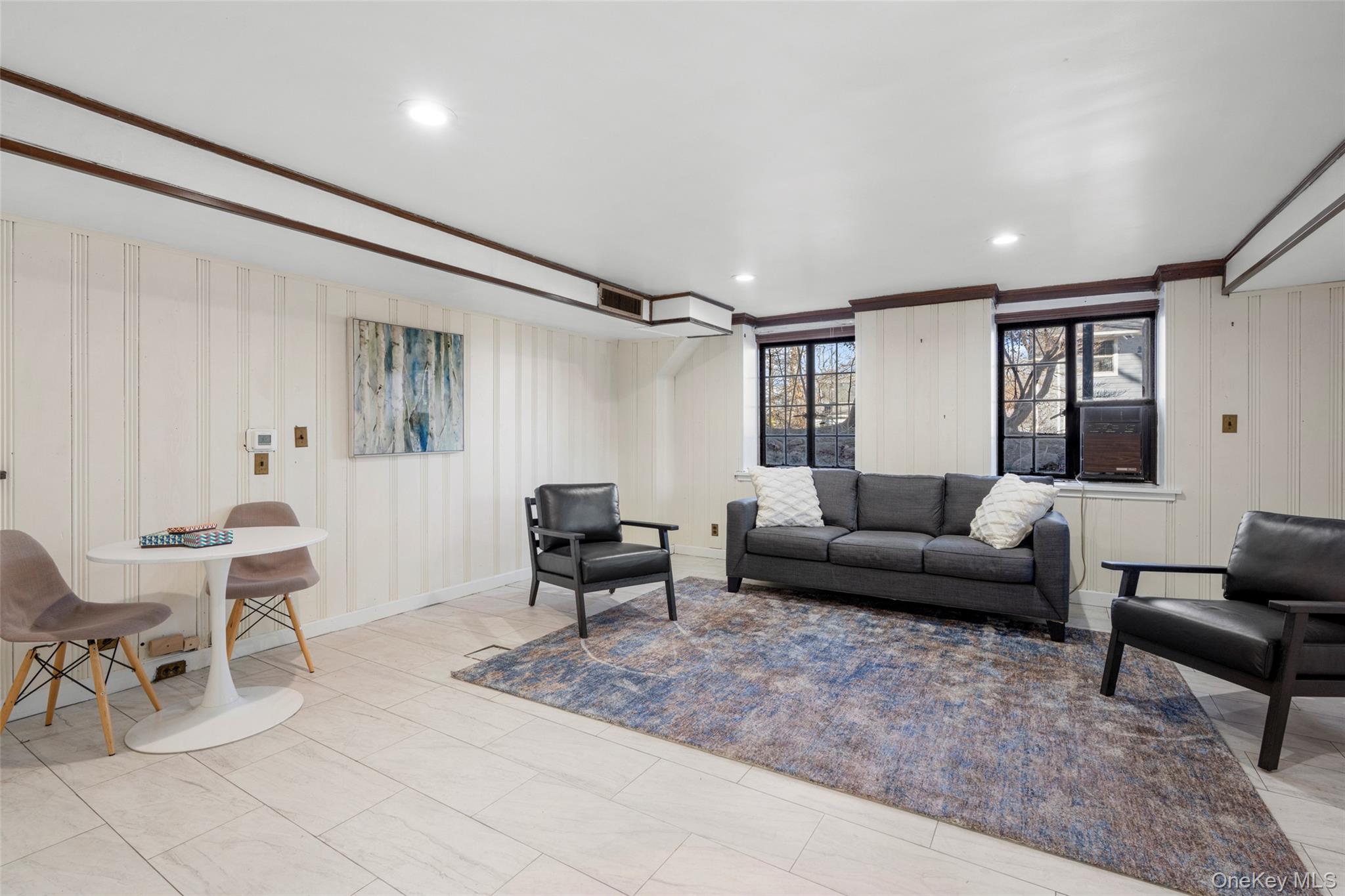 60 Wildwood Road New Rochelle, NY 10804 - Photo 37 of 49 a living room with furniture and a wooden floor