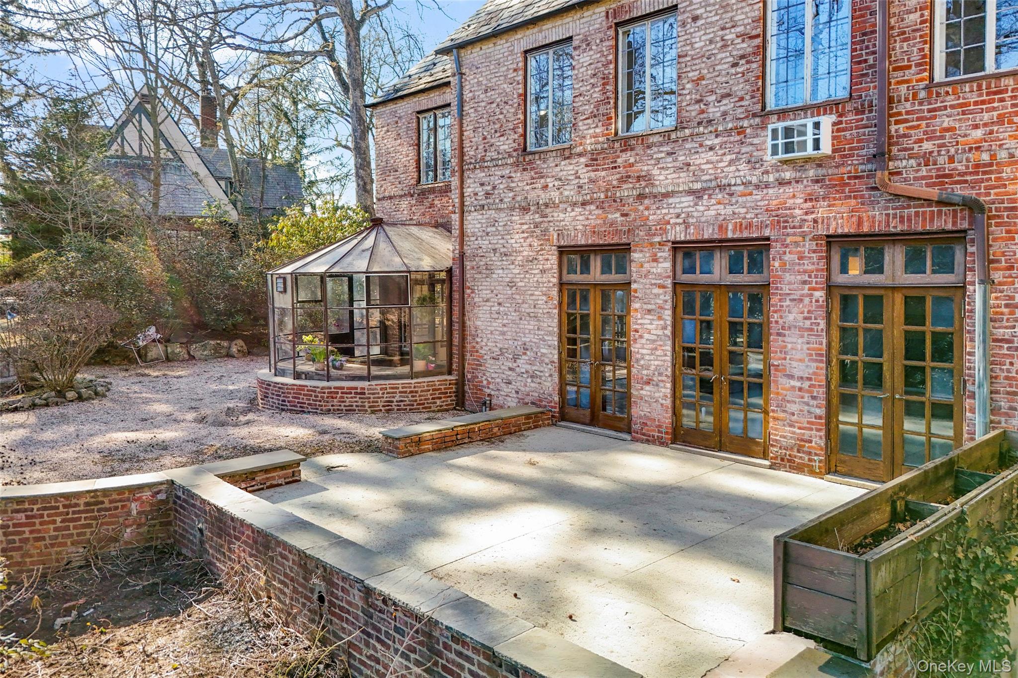 60 Wildwood Road New Rochelle, NY 10804 - Photo 39 of 49 a view of a brick house with many windows