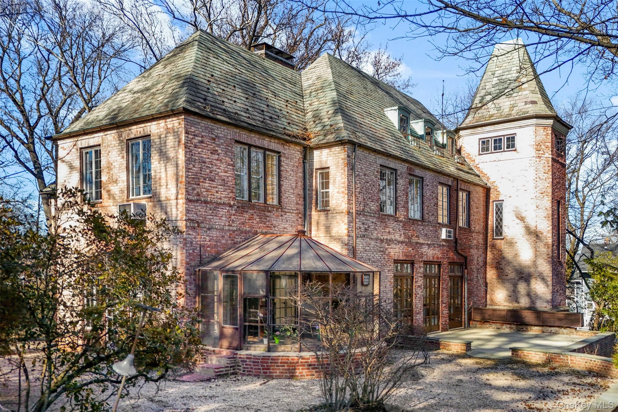 60 Wildwood Road New Rochelle, NY 10804 - Photo 40 of 49 a front view of a house with yard and trees around