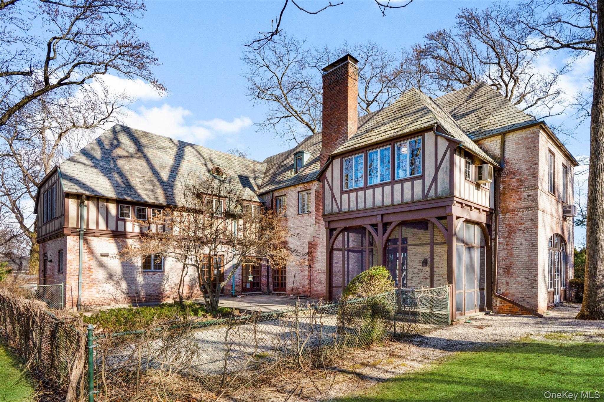 60 Wildwood Road New Rochelle, NY 10804 - Photo 43 of 49 a front view of a building with garden and seating space