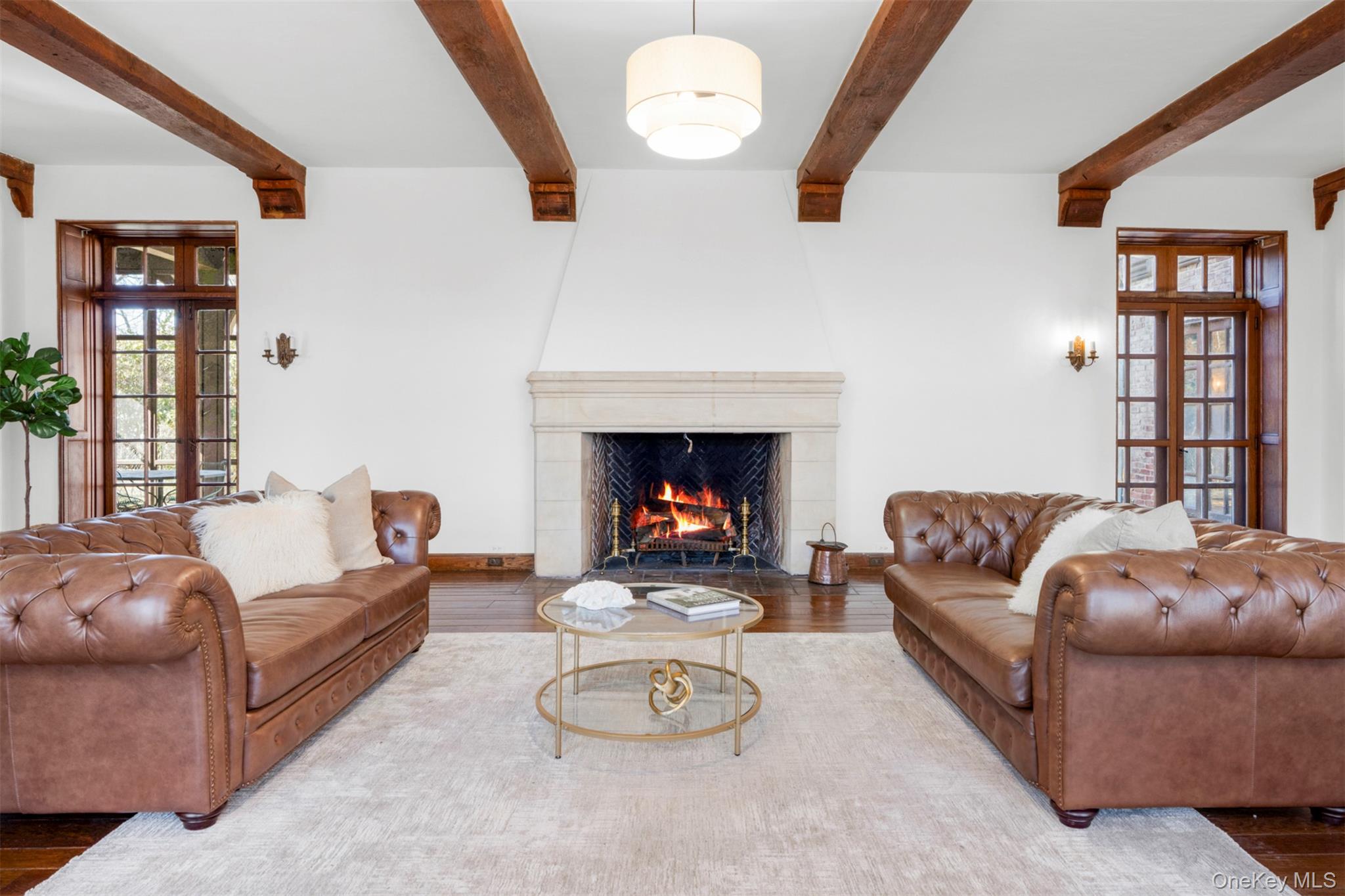 60 Wildwood Road New Rochelle, NY 10804 - Photo 7 of 49 a living room with furniture and a fireplace