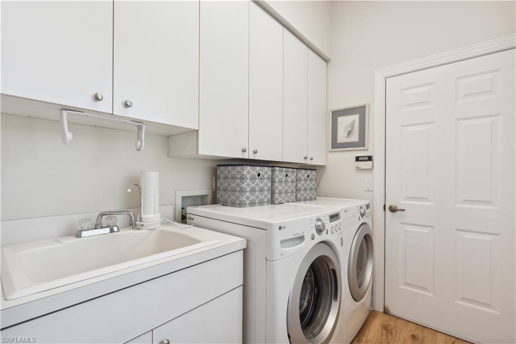 5049 Fairhaven Lane Naples, FL 34109 - Photo 18 of 46 a utility room with dryer and washer