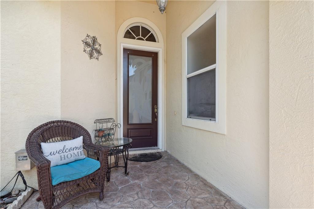 5049 Fairhaven Lane Naples, FL 34109 - Photo 19 of 46 a living room with furniture and a window