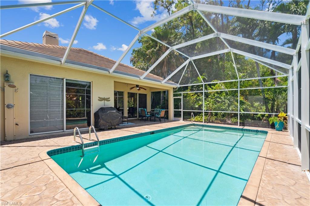 5049 Fairhaven Lane Naples, FL 34109 - Photo 21 of 46 a view of a backyard with a patio and a patio