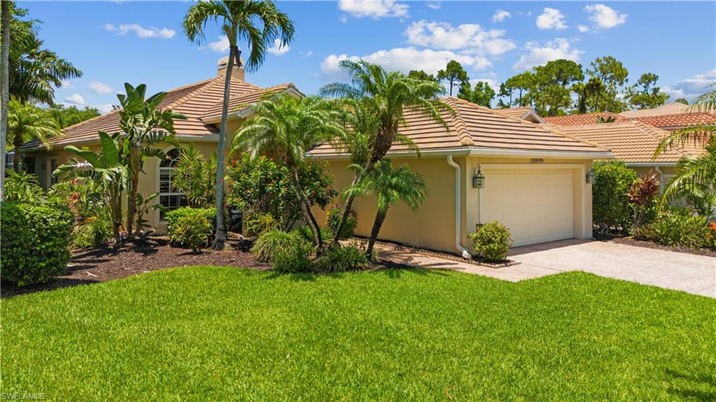 5049 Fairhaven Lane Naples, FL 34109 - Photo 28 of 46 a view of a house with a yard and potted plants
