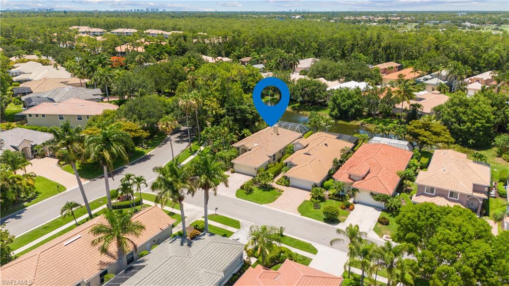5049 Fairhaven Lane Naples, FL 34109 - Photo 34 of 46 an aerial view of a house with a yard lake view and mountain view