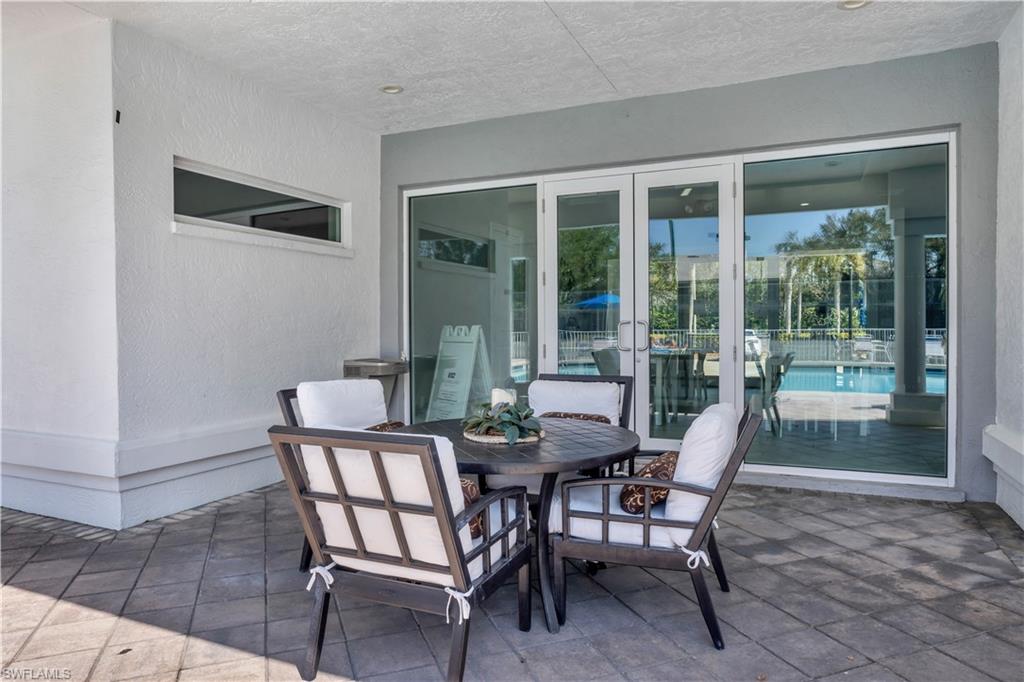 5049 Fairhaven Lane Naples, FL 34109 - Photo 38 of 46 a view of a dining room with furniture and front door