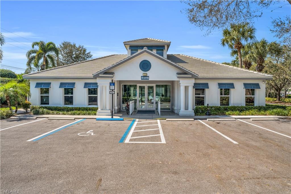 5049 Fairhaven Lane Naples, FL 34109 - Photo 44 of 46 a front view of a house with a yard and potted plants