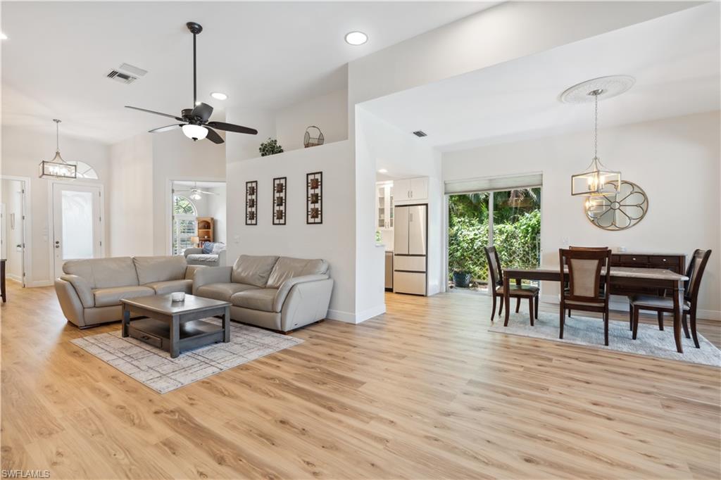 5049 Fairhaven Lane Naples, FL 34109 - Photo 8 of 46 a living room with furniture wooden floor and a window