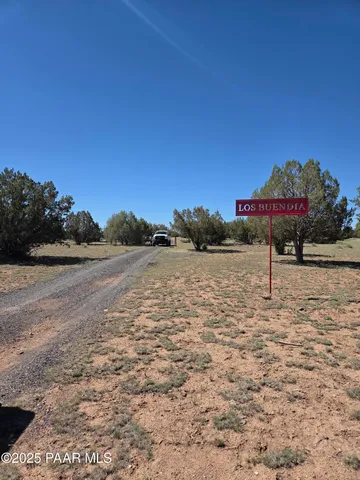 a view of a lake with a yard