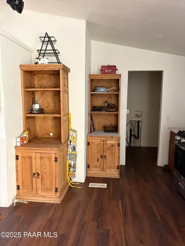 a kitchen with stainless steel appliances granite countertop a stove and a refrigerator
