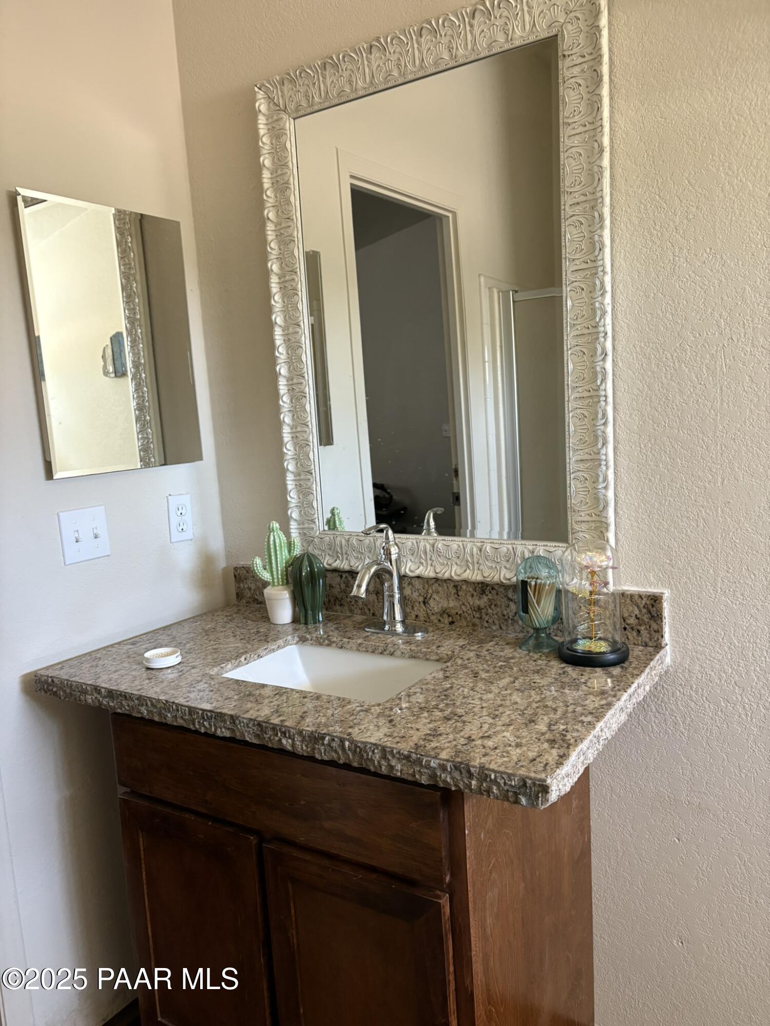 42650 North Wayne Road Ash Fork, AZ 86320 - Photo 33 of 37 a bathroom with a granite countertop sink and a mirror