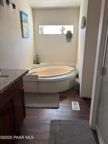 a bedroom with a bed and a desk