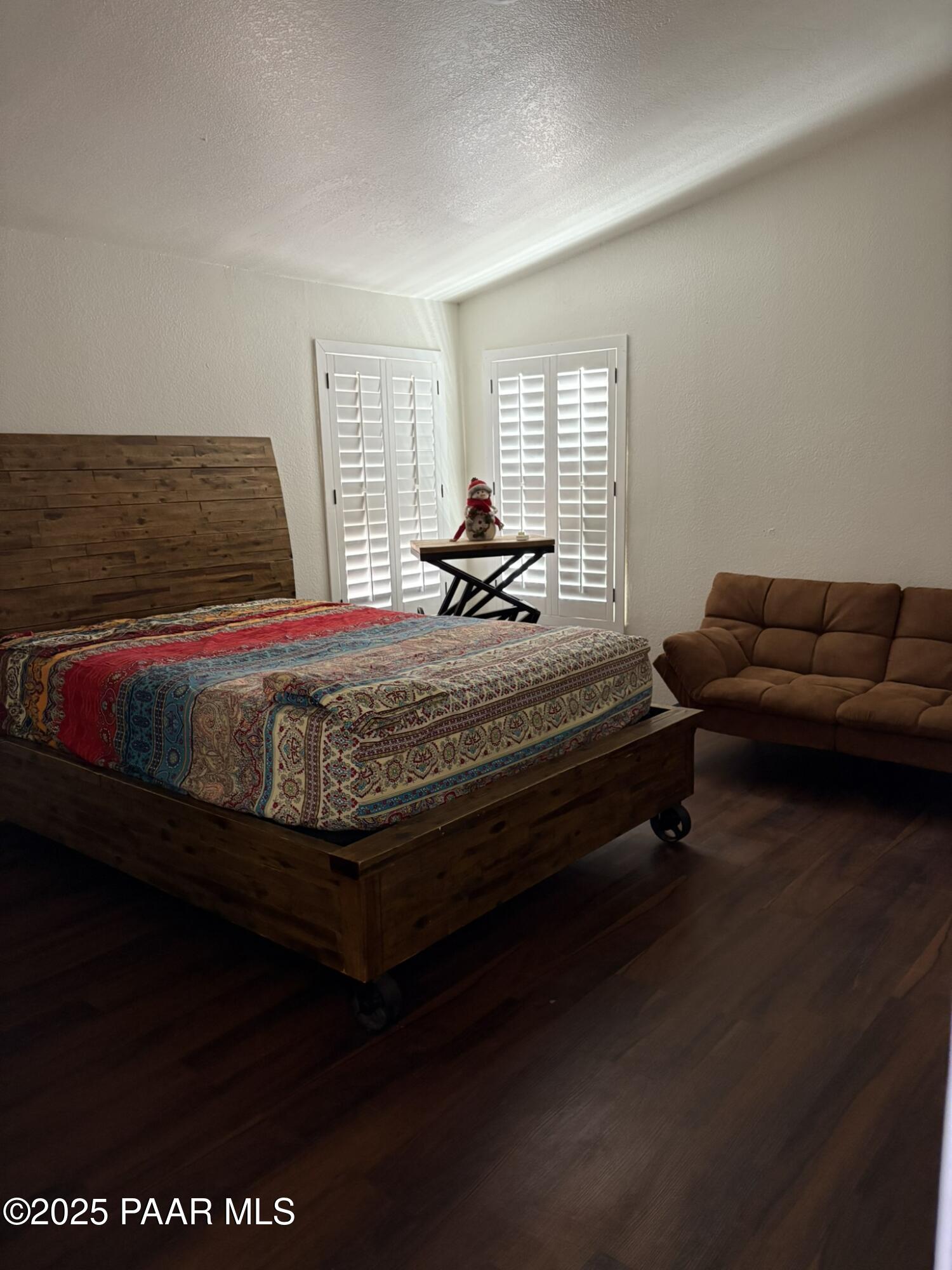 42650 North Wayne Road Ash Fork, AZ 86320 - Photo 36 of 37 a bedroom with furniture and a wooden floor