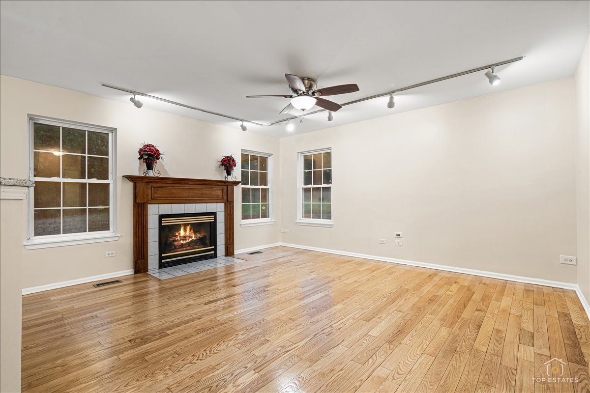 7 Eagle Court Streamwood, IL 60107 - Photo 13 of 31 a view of empty room with a fireplace and a window