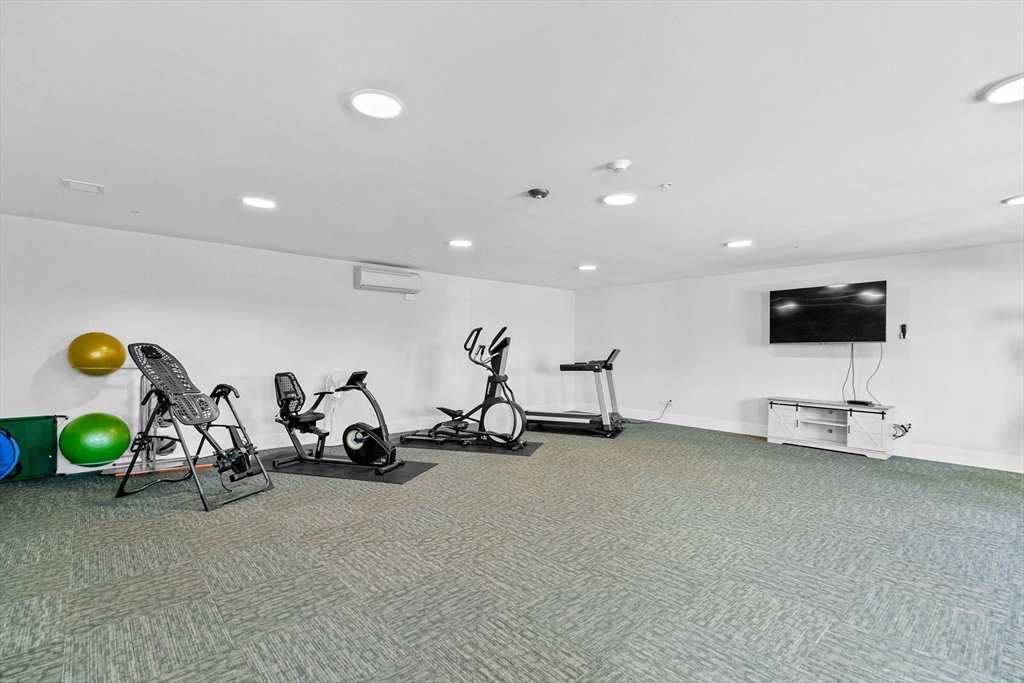 57 Long Point Road, Unit 210 Lakeville, MA 02347 - Photo 20 of 27 a view of a room with gym equipment