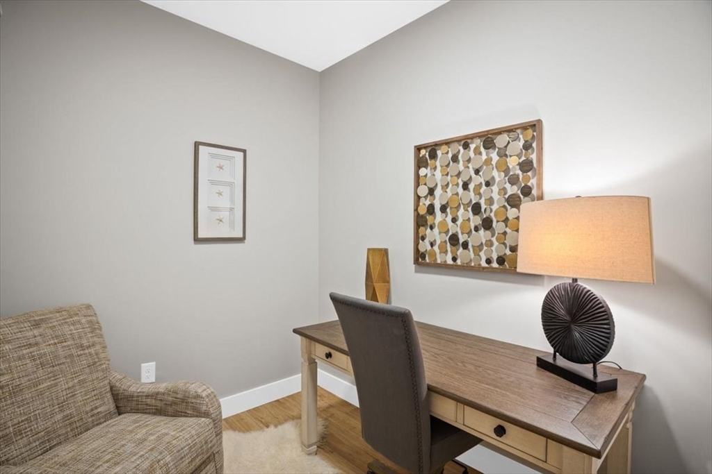 57 Long Point Road, Unit 210 Lakeville, MA 02347 - Photo 9 of 27 a living room with furniture and a window