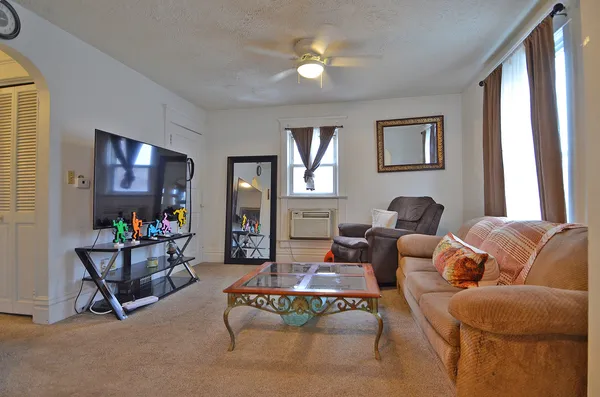 a living room with furniture and a window
