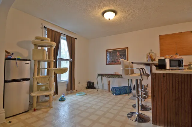a view of livingroom with furniture and workspace