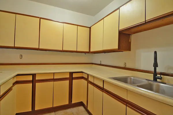 a kitchen with a sink and cabinets