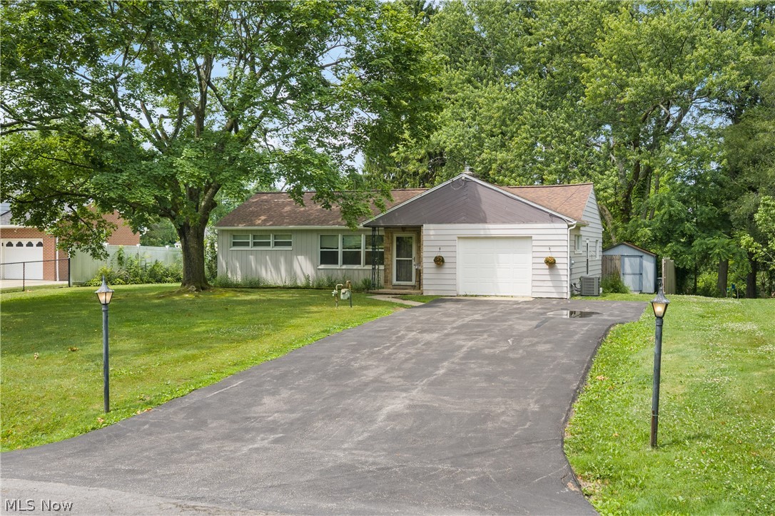 5768 Nolley Road Akron, OH 44319 - Photo 2 of 38 Ranch-style residence featuring white siding and an attached single-car garage