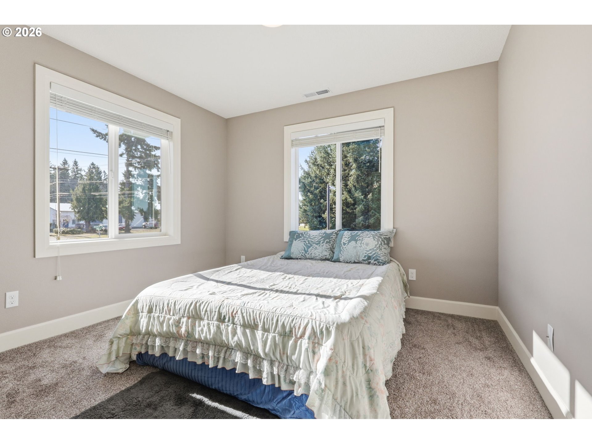 16994 University Avenue Sandy, OR 97055 - Photo 11 of 22 a bedroom with a bed window and mirror