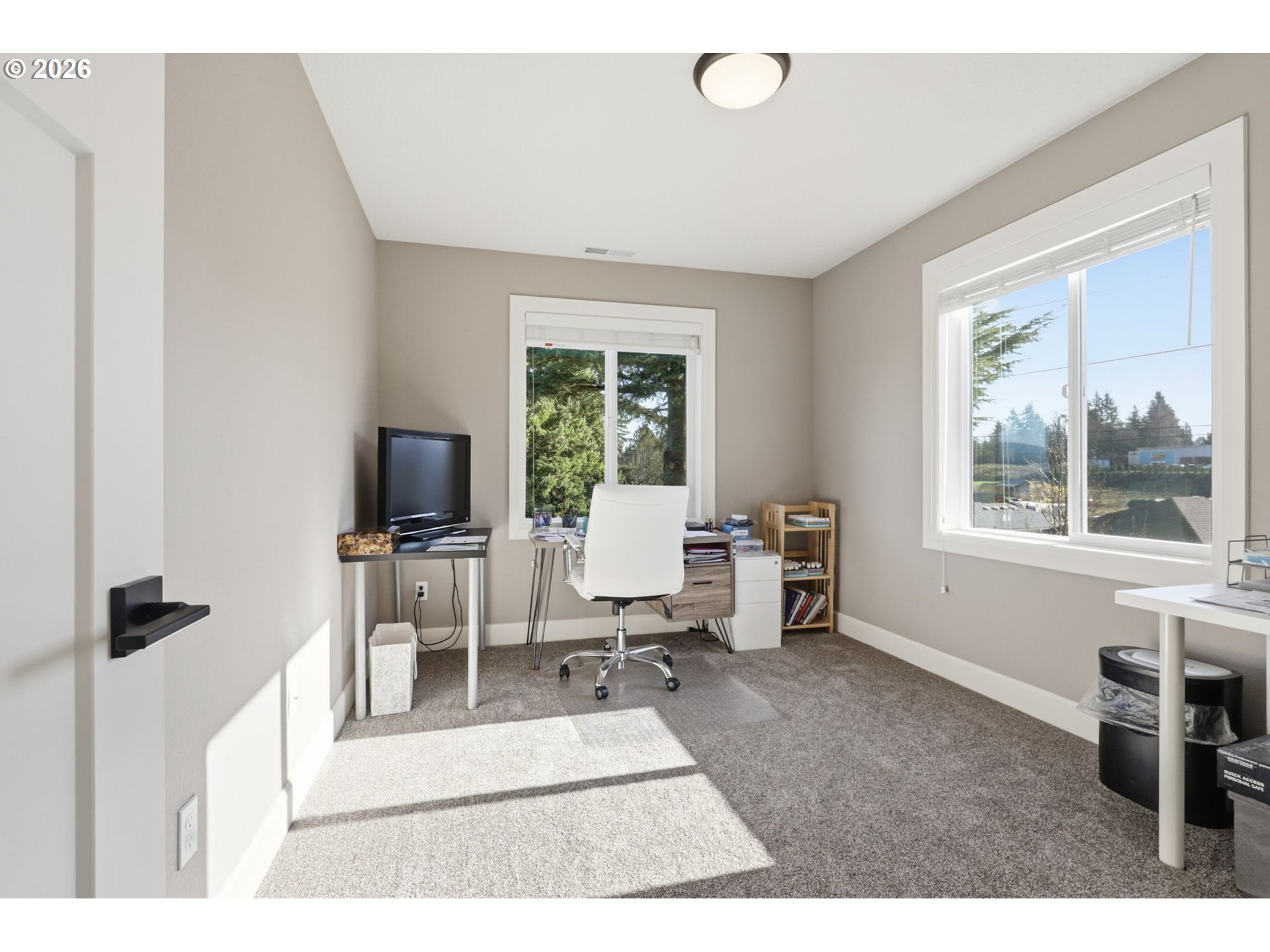 16994 University Avenue Sandy, OR 97055 - Photo 14 of 22 a living room with furniture a flat screen tv and a window