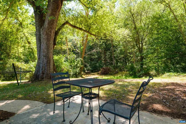 a view of a yard with a table and chair