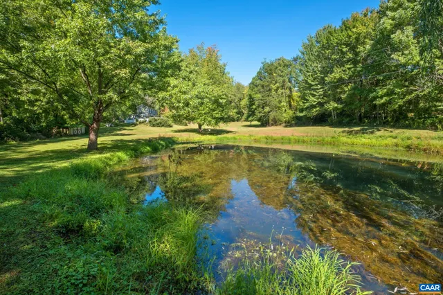 a view of a lake with a yard