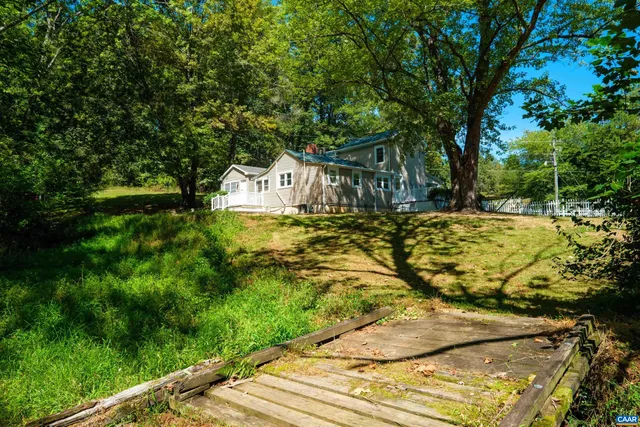 a view of yard along with trees