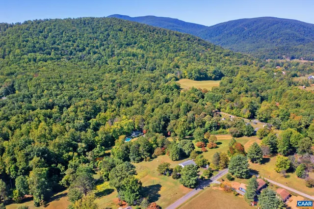 a view of a large with lush green forest